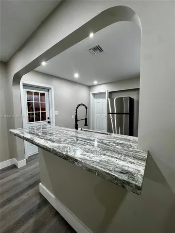 a large kitchen with cabinets