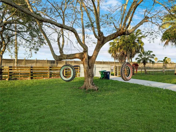 a view of yard with swimming pool