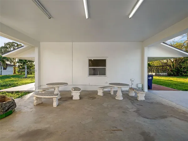a room with a large window and view of living room