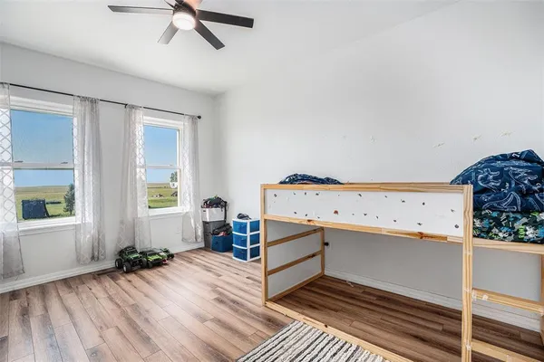 a bedroom with a bed and a view of bathroom