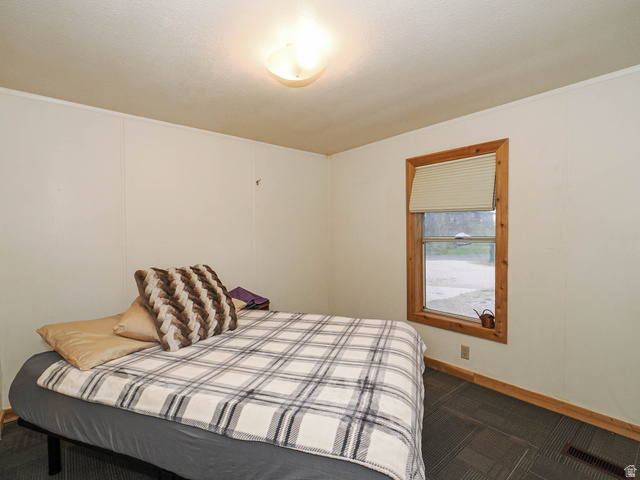 94 Spring Canyon Road Coalville, UT 84017 - Photo 46 of 50 Recessed lighting illuminates an interior space featuring a window with natural wood trim and a light-filtering blind