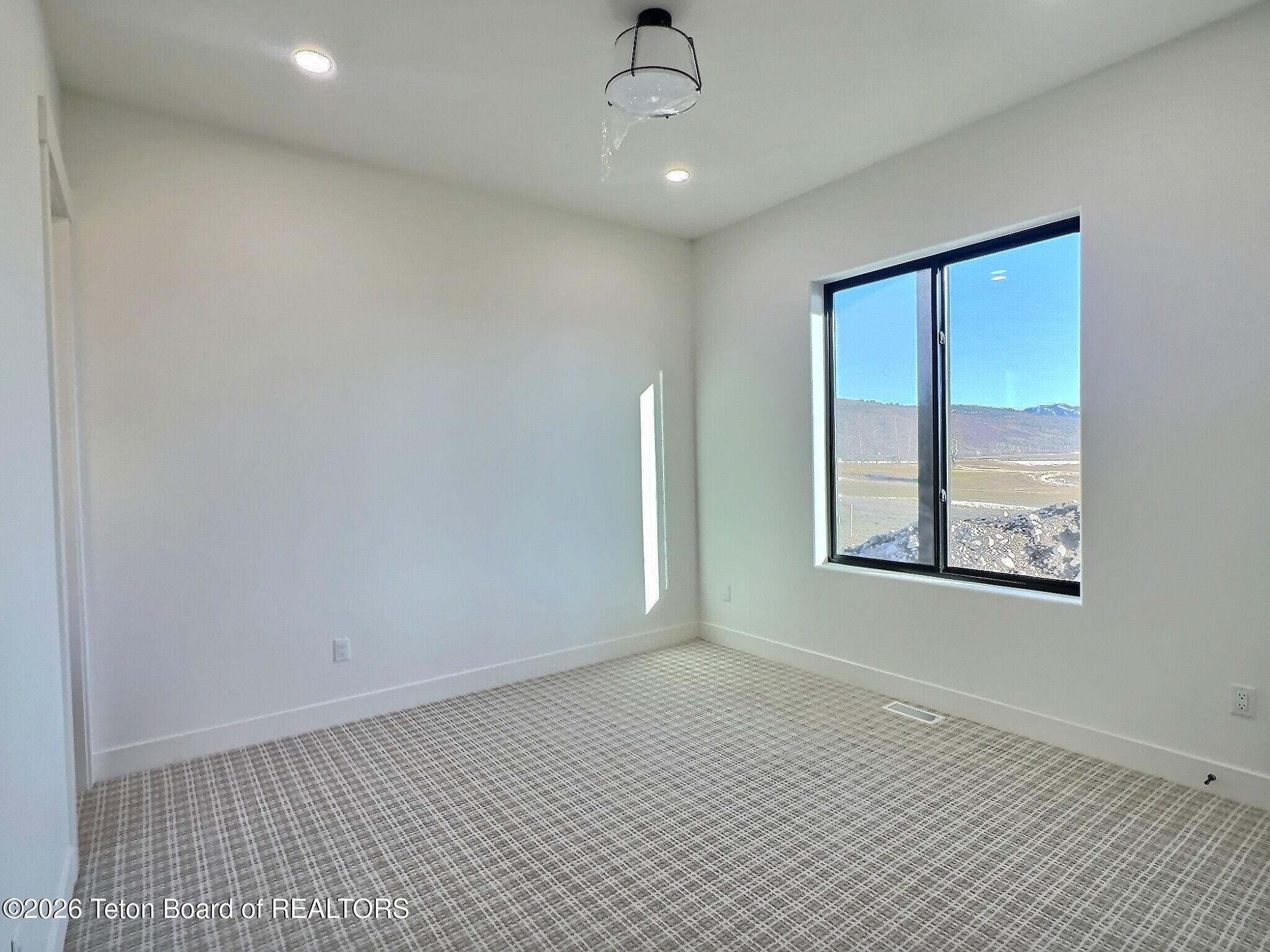 371 Desert Fox Lane Victor, ID 83455 - Photo 31 of 46 main floor guest 1