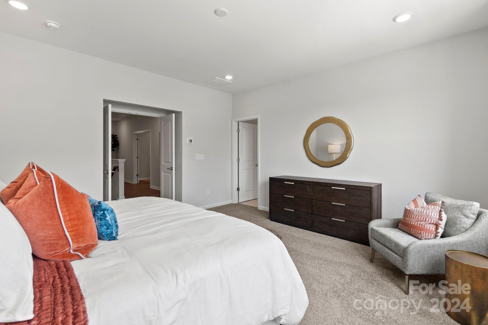 1133 Lost Cv Road Indian Land, SC 29707 - Photo 22 of 42 a bedroom with a bed and a dresser