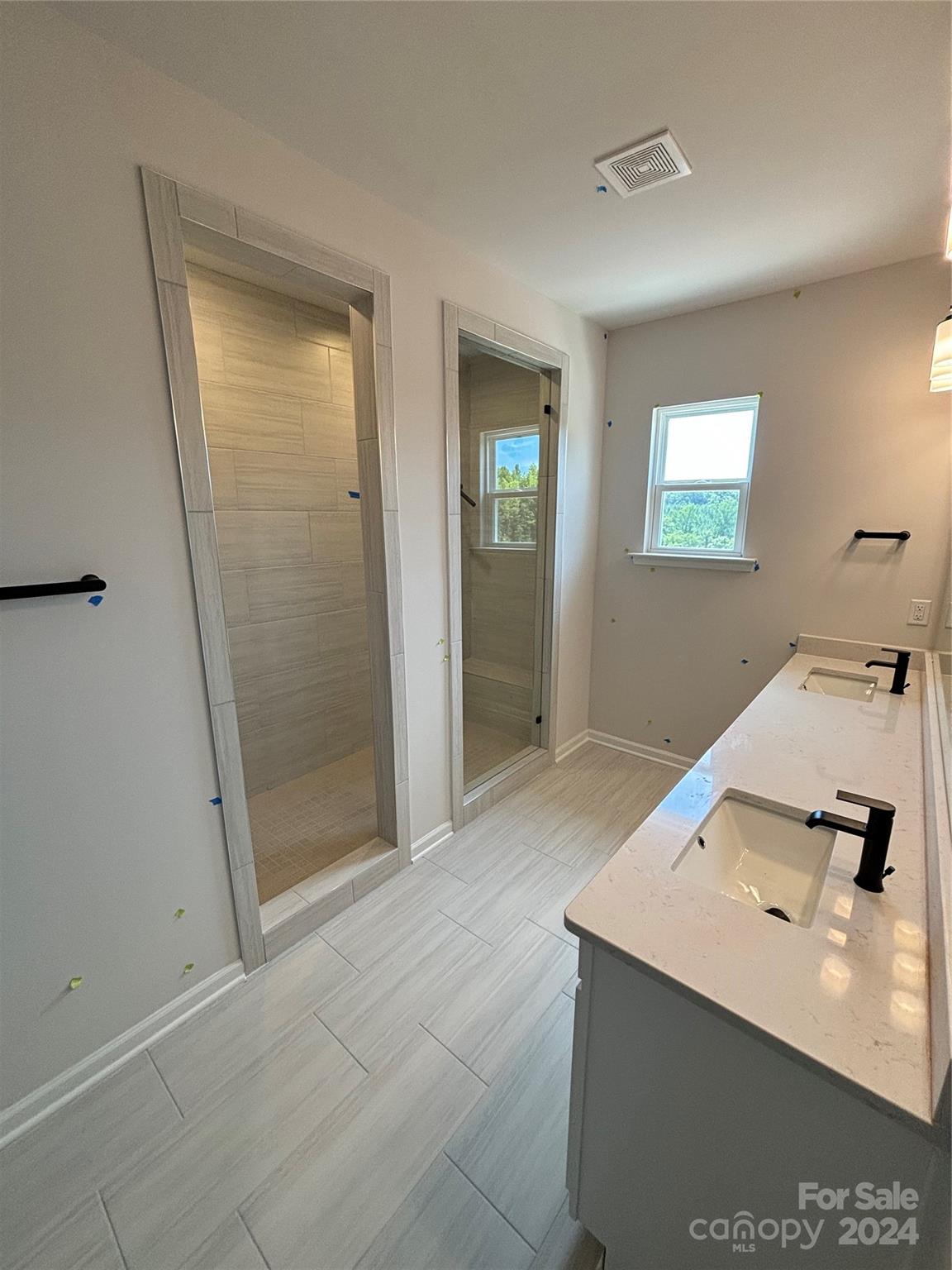 1133 Lost Cv Road Indian Land, SC 29707 - Photo 38 of 42 a bathroom with a sink a mirror and shower