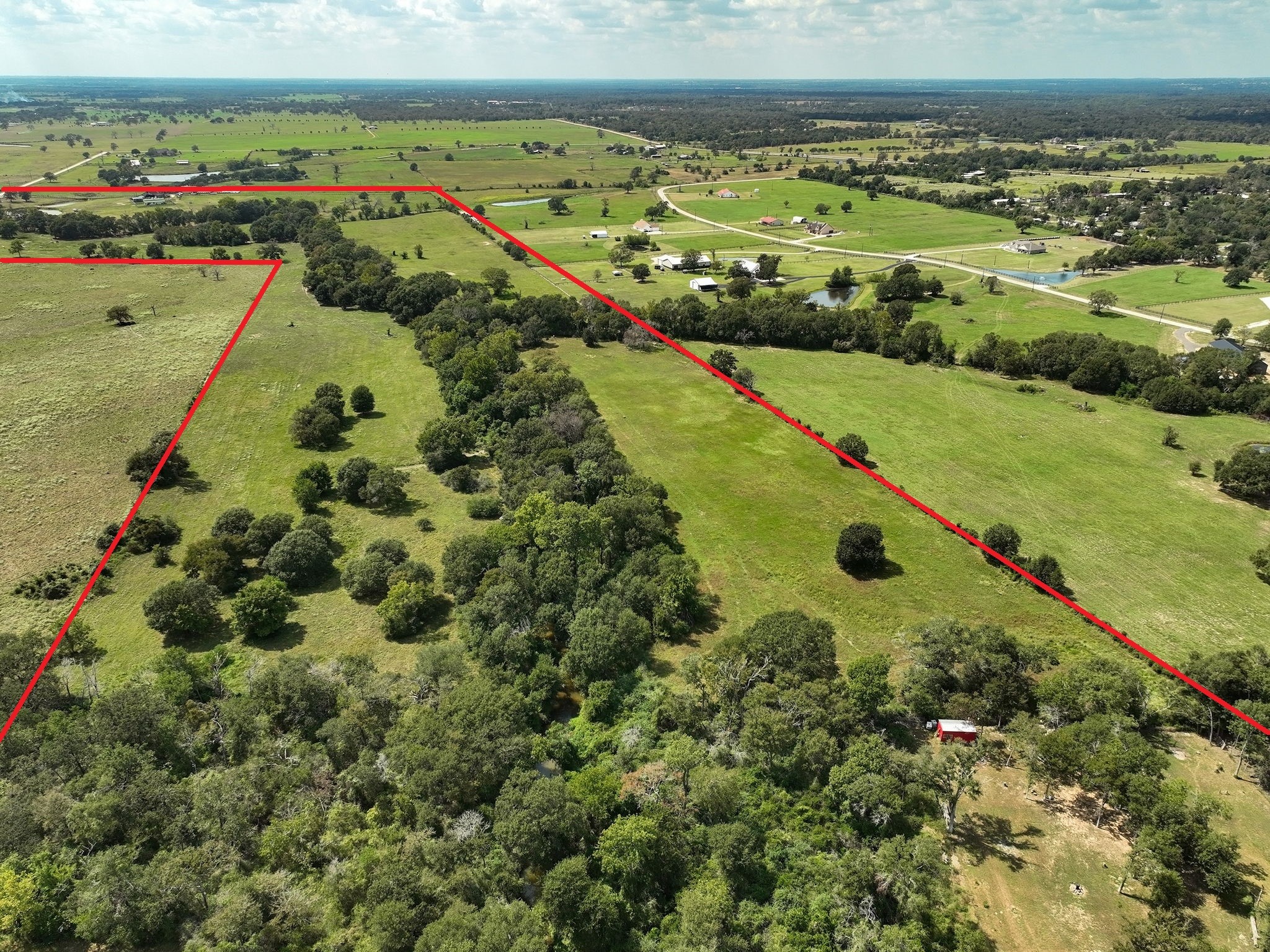 24783 Nine Bar Road Hempstead, TX 77445 - Photo 37 of 42 an aerial view of a residential houses with outdoor space and swimming pool