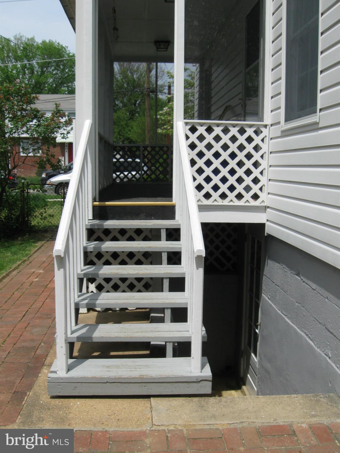 1607 Neely Road Silver Spring, MD 20903 - Photo 22 of 24 Stairs to porch and walk-out lower level