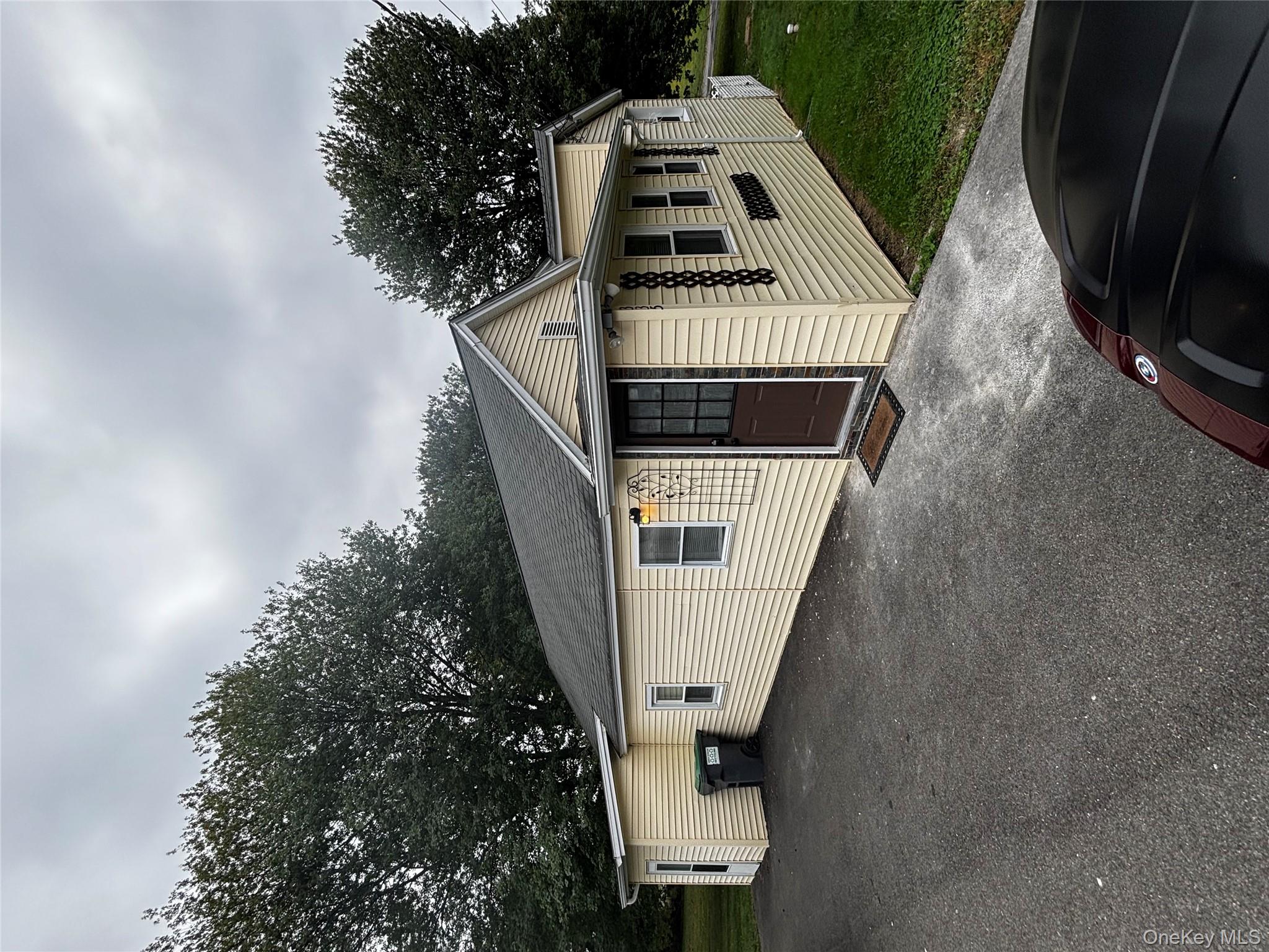 333 Bingham Road Marlboro, NY 12542 - Photo 1 of 27 a view of a house with a yard and garage
