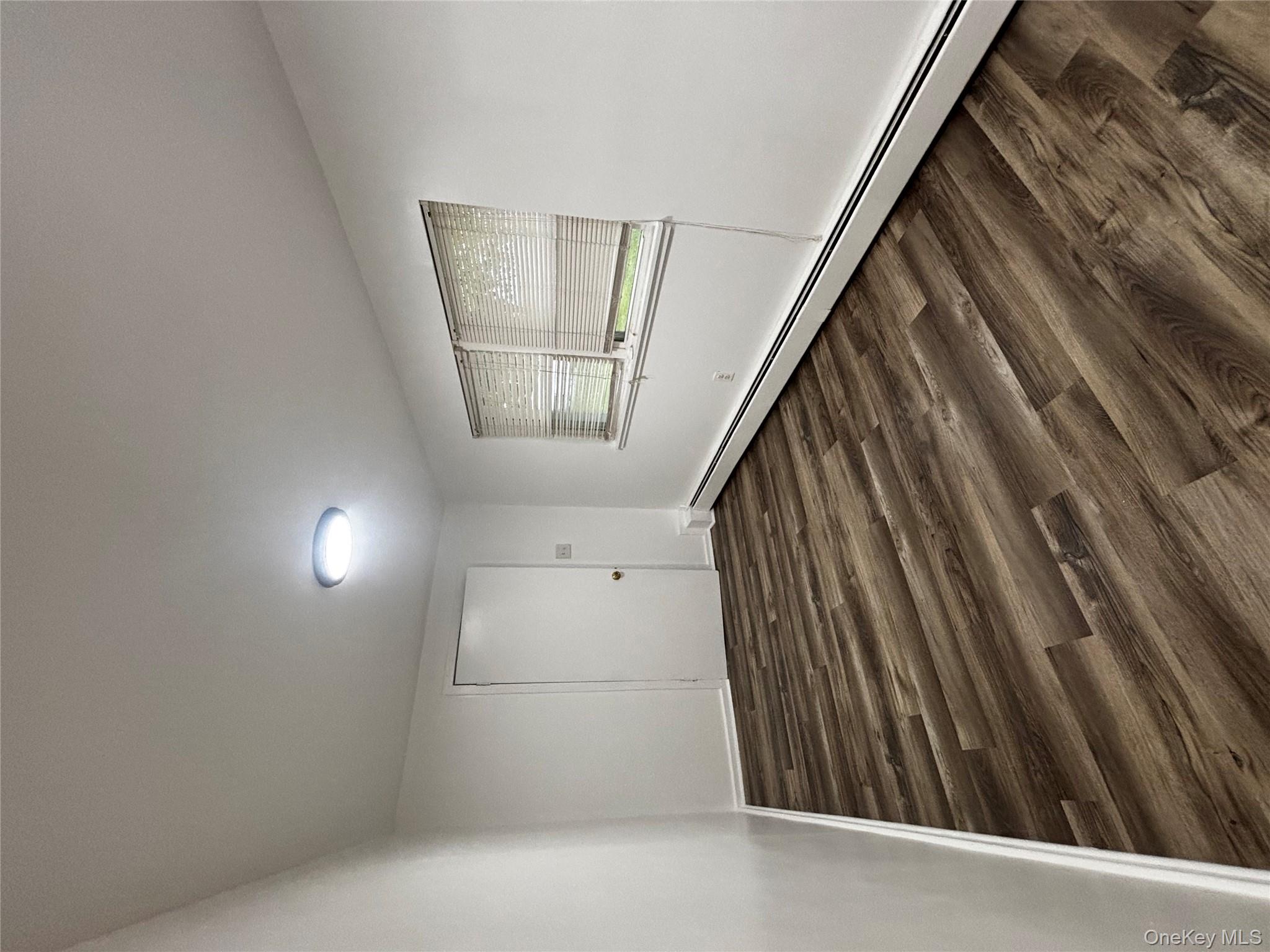 333 Bingham Road Marlboro, NY 12542 - Photo 2 of 27 a view of empty room with wooden floor and fan