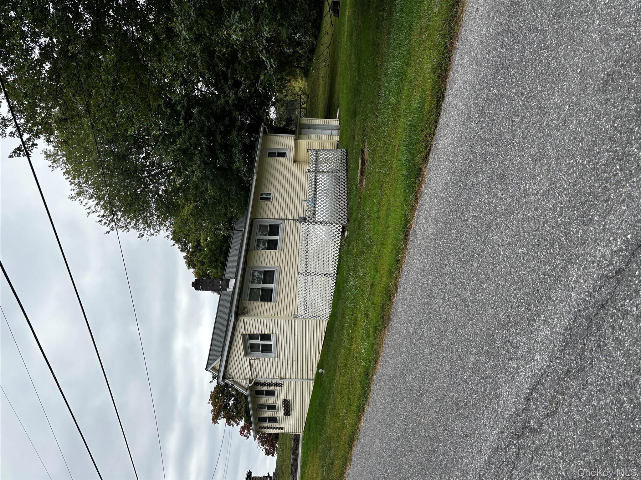 333 Bingham Road Marlboro, NY 12542 - Photo 26 of 27 a front view of a house with a yard and garage