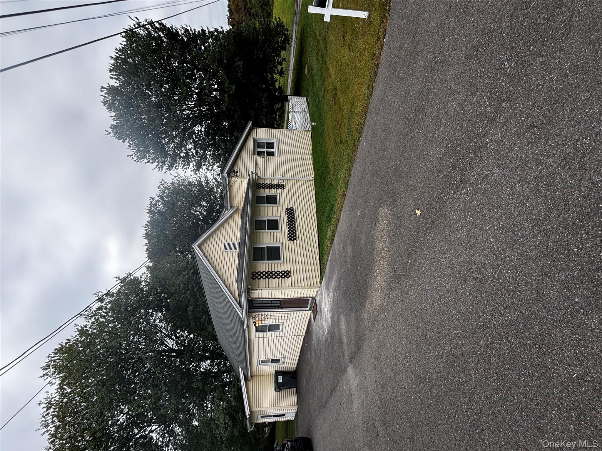 333 Bingham Road Marlboro, NY 12542 - Photo 27 of 27 a white house with a big yard and large trees