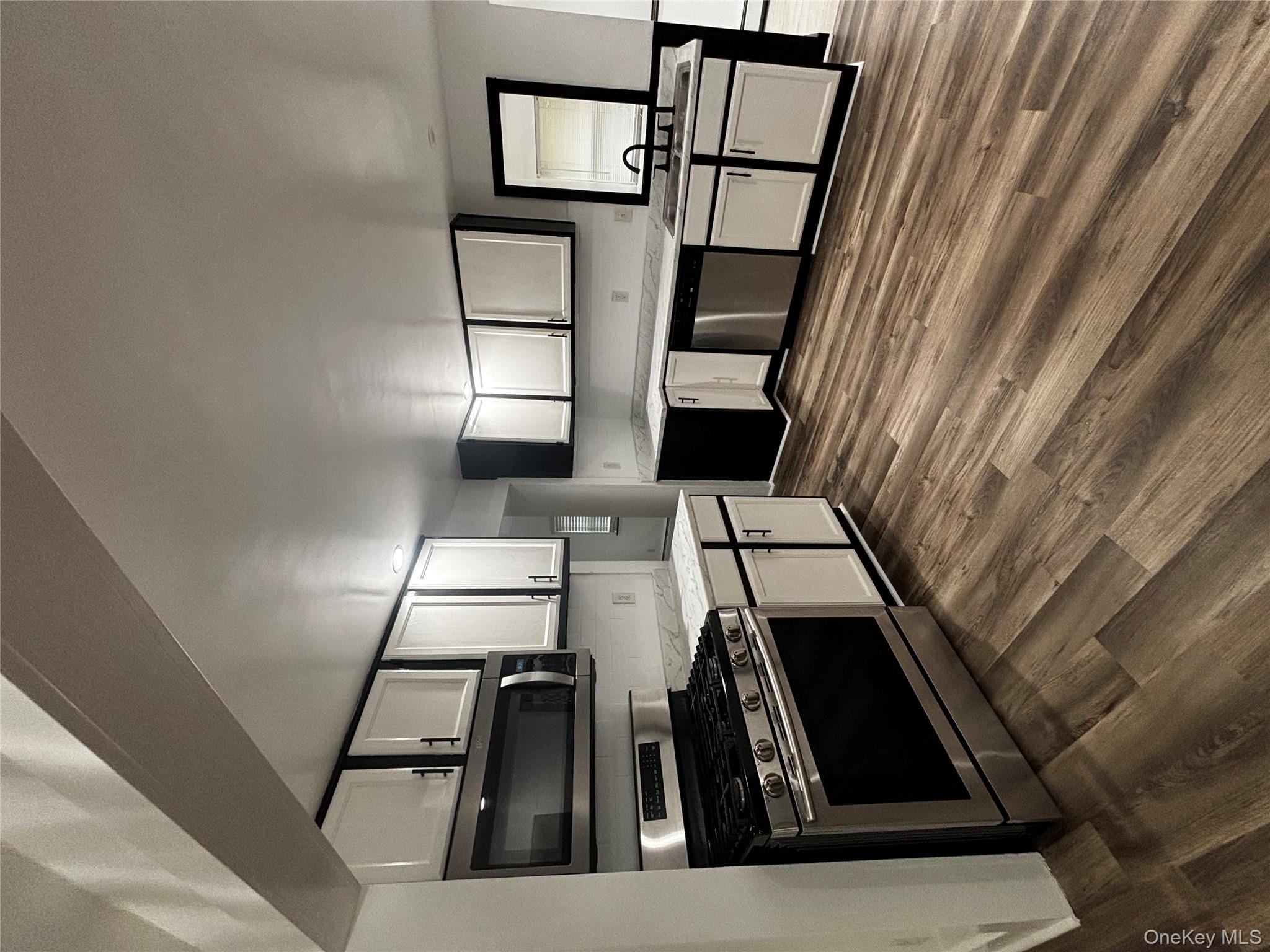 333 Bingham Road Marlboro, NY 12542 - Photo 6 of 27 a kitchen with stainless steel appliances granite countertop a stove a sink and a refrigerator