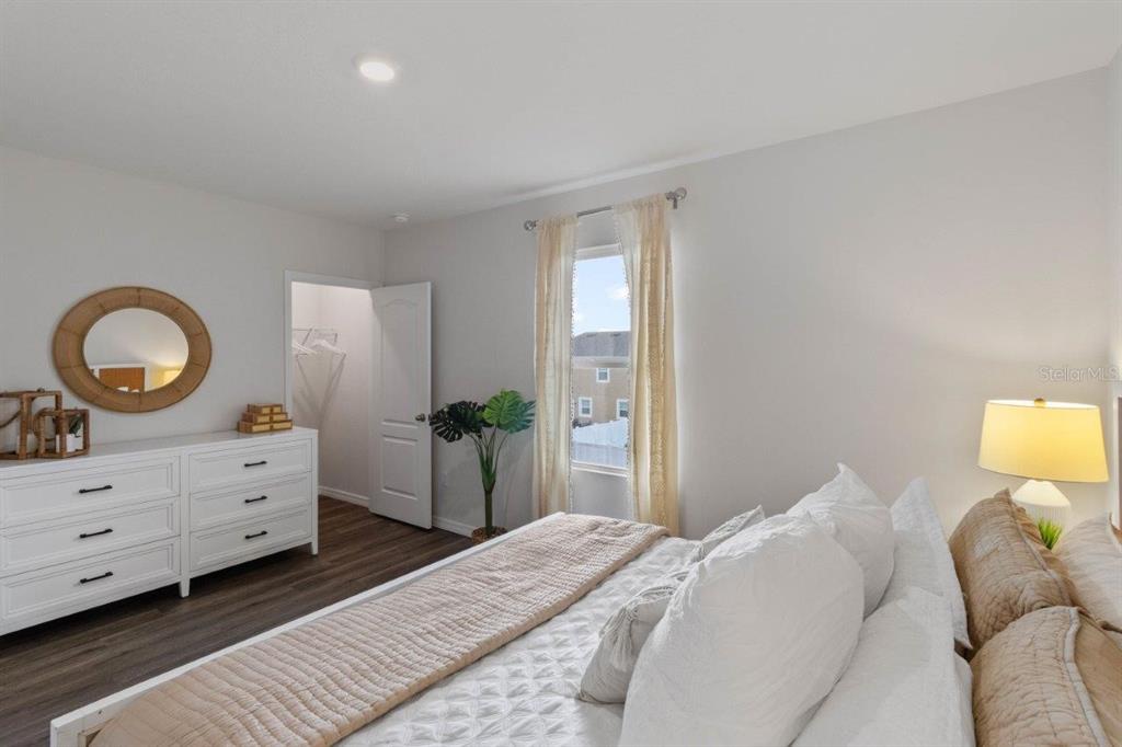 2717 Gladiola Road Kissimmee, FL 34759 - Photo 23 of 25 a bedroom with a bed and a dresser