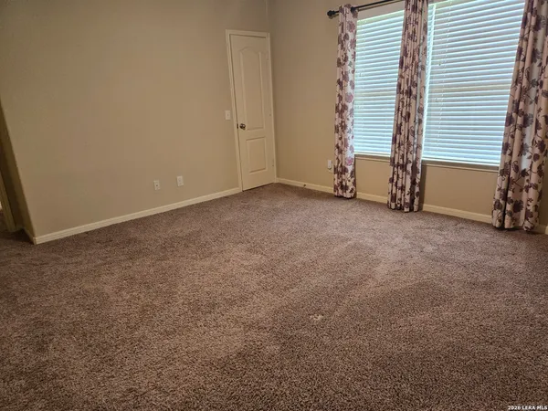 a view of an empty room with stairs