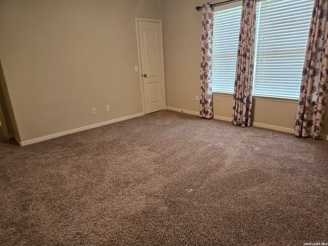 a view of an empty room with stairs