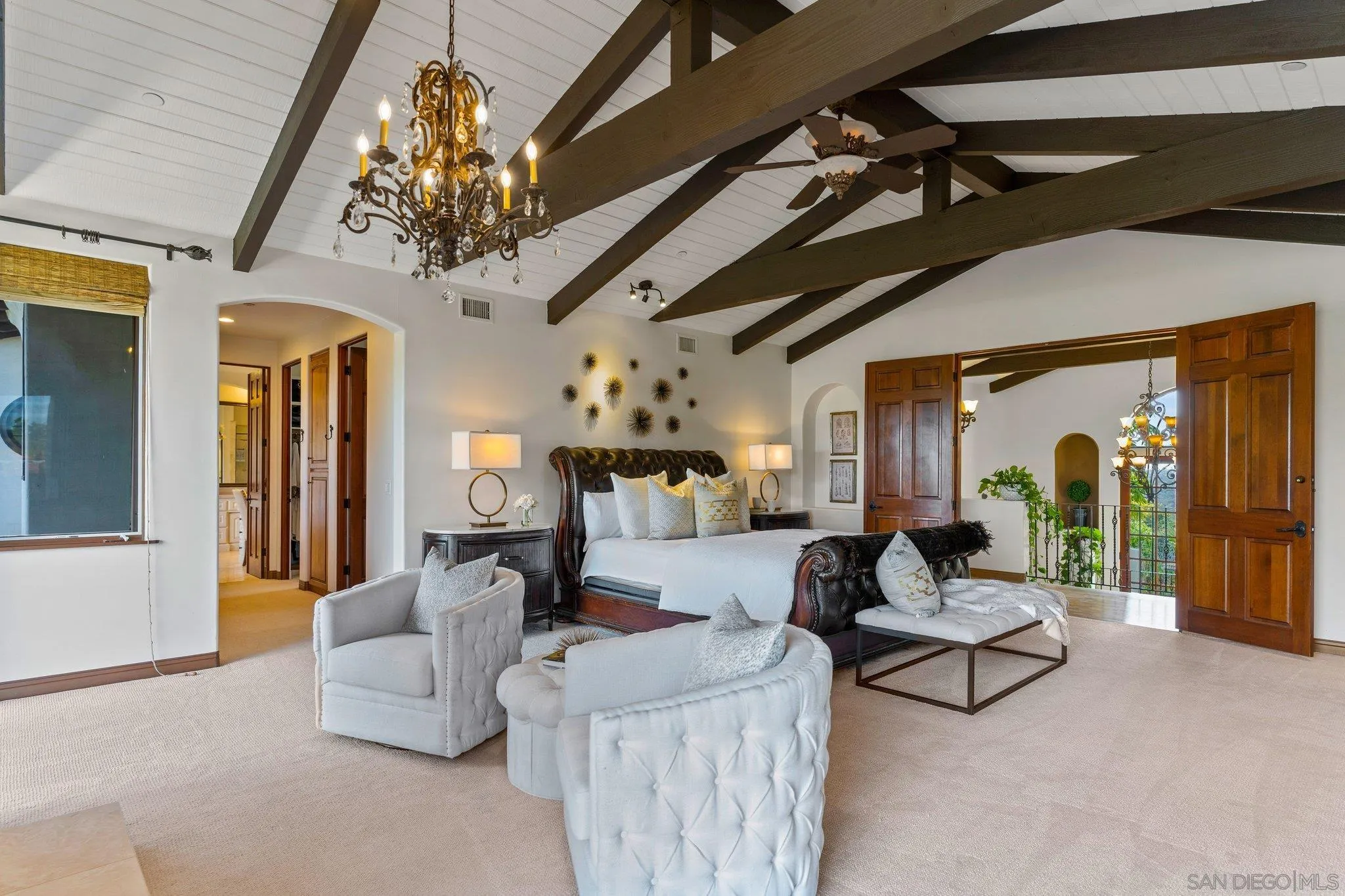 3381 Calle Margarita Encinitas, CA 92024 - Photo 16 of 47 a living room with furniture and a chandelier
