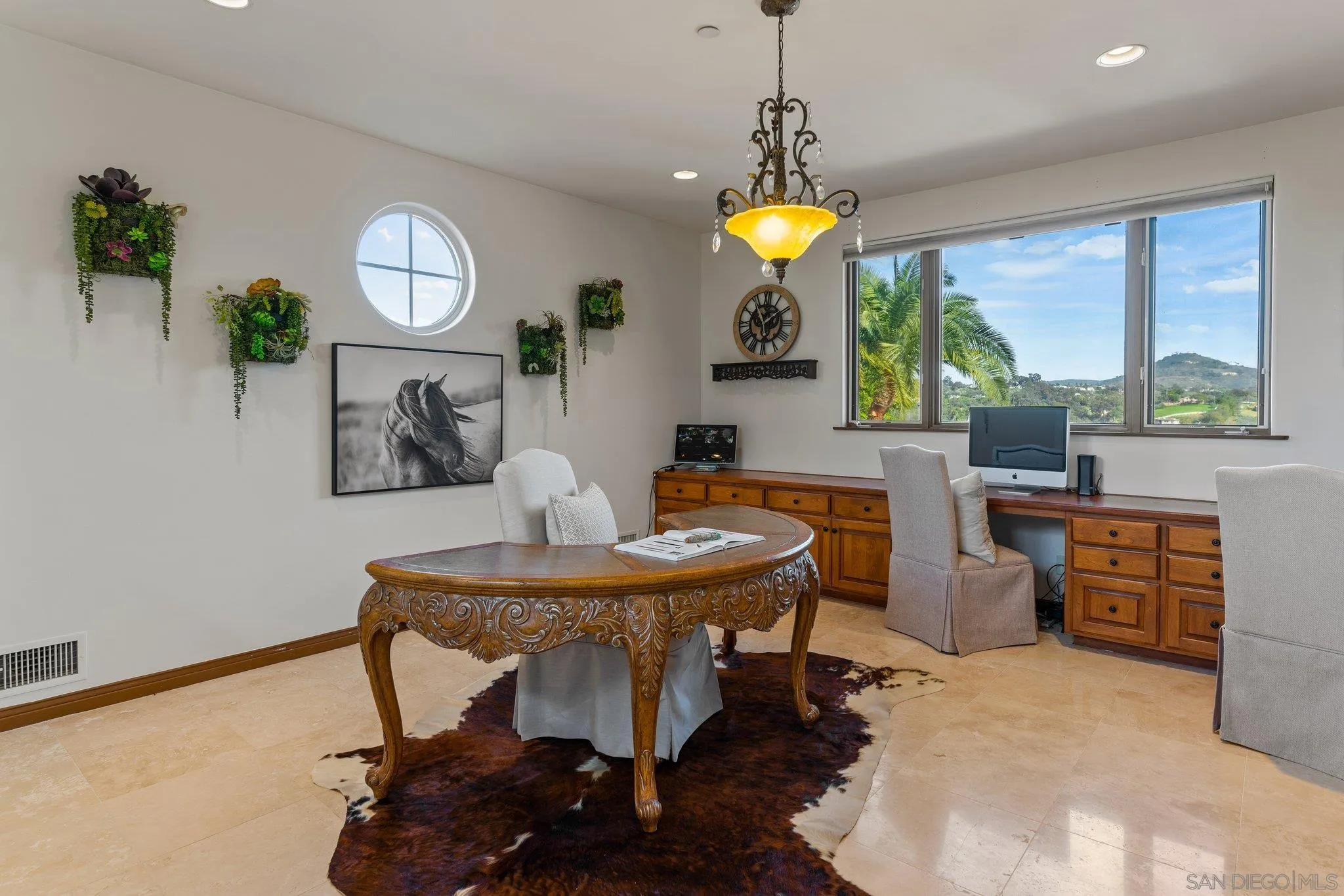 3381 Calle Margarita Encinitas, CA 92024 - Photo 19 of 47 a view of a dining room with furniture a chandelier and wooden floor