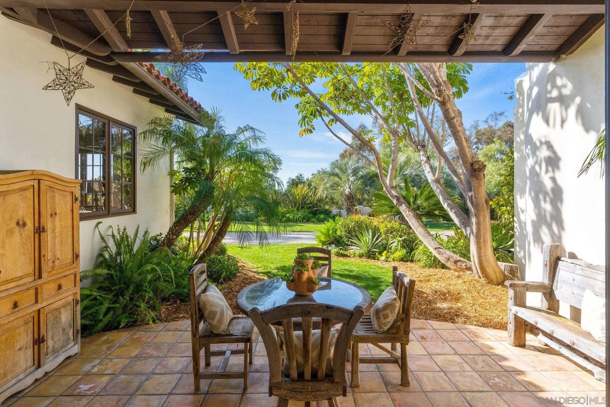 3381 Calle Margarita Encinitas, CA 92024 - Photo 22 of 47 a view of a patio with table and chairs and potted plants