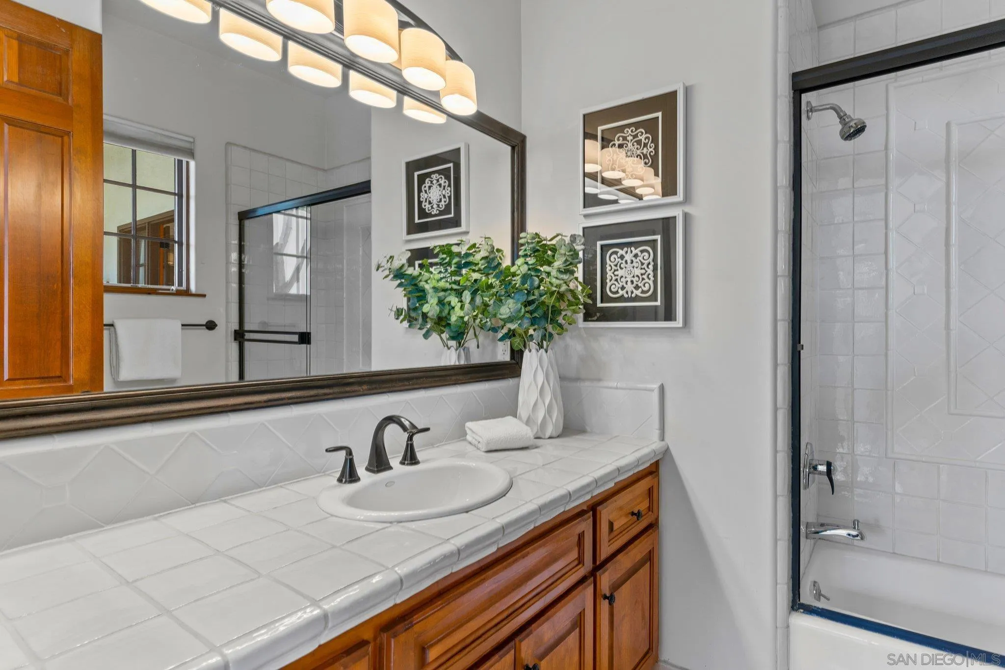 3381 Calle Margarita Encinitas, CA 92024 - Photo 29 of 47 a bathroom with a sink and a mirror