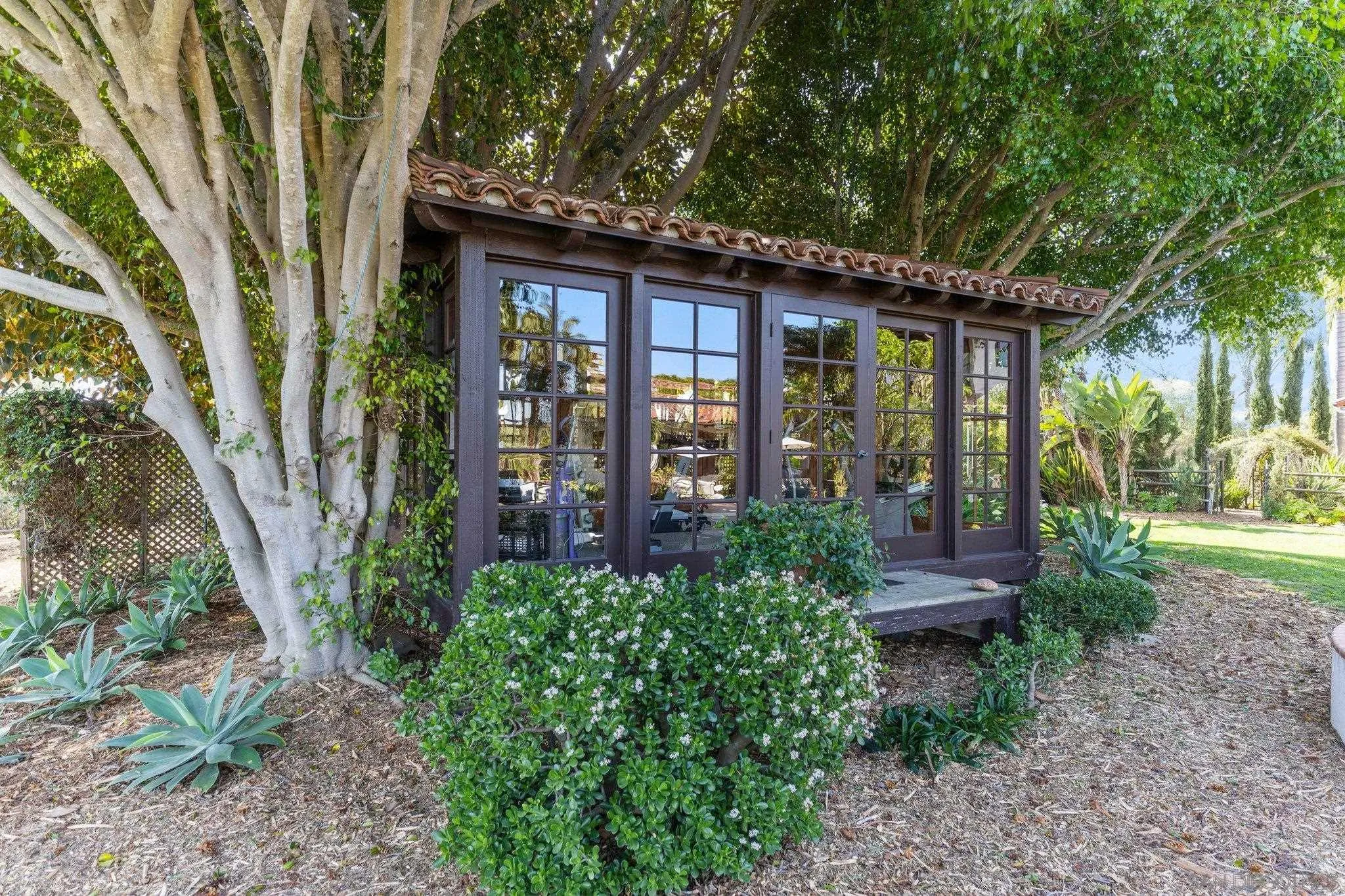 3381 Calle Margarita Encinitas, CA 92024 - Photo 35 of 47 a view of a house with porch and garden
