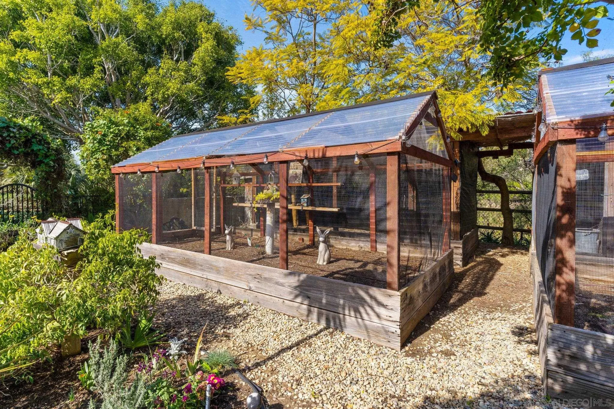 3381 Calle Margarita Encinitas, CA 92024 - Photo 45 of 47 a view of a house with backyard porch and sitting area
