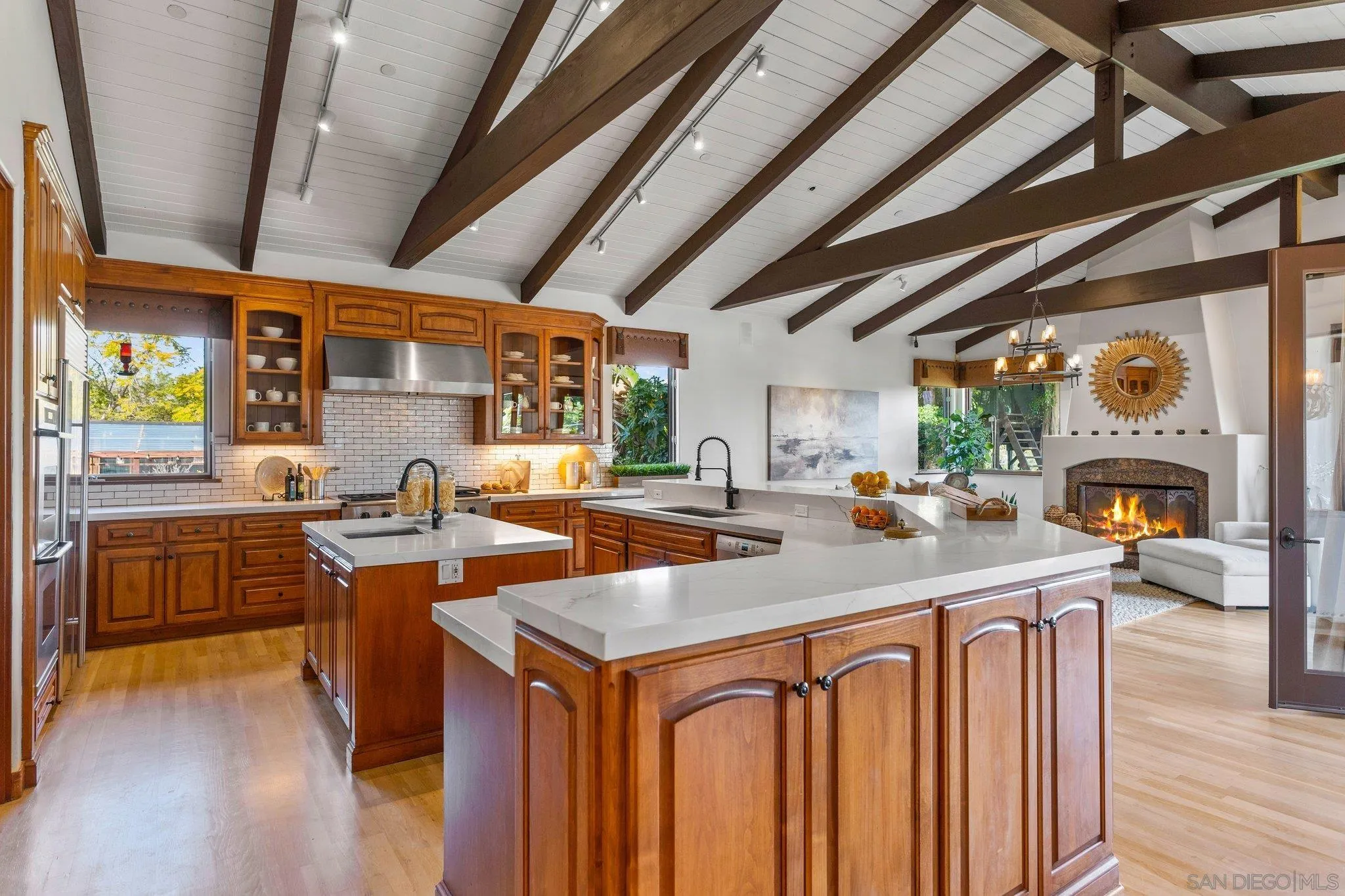 3381 Calle Margarita Encinitas, CA 92024 - Photo 9 of 47 a kitchen with sink a counter top space and stainless steel appliances