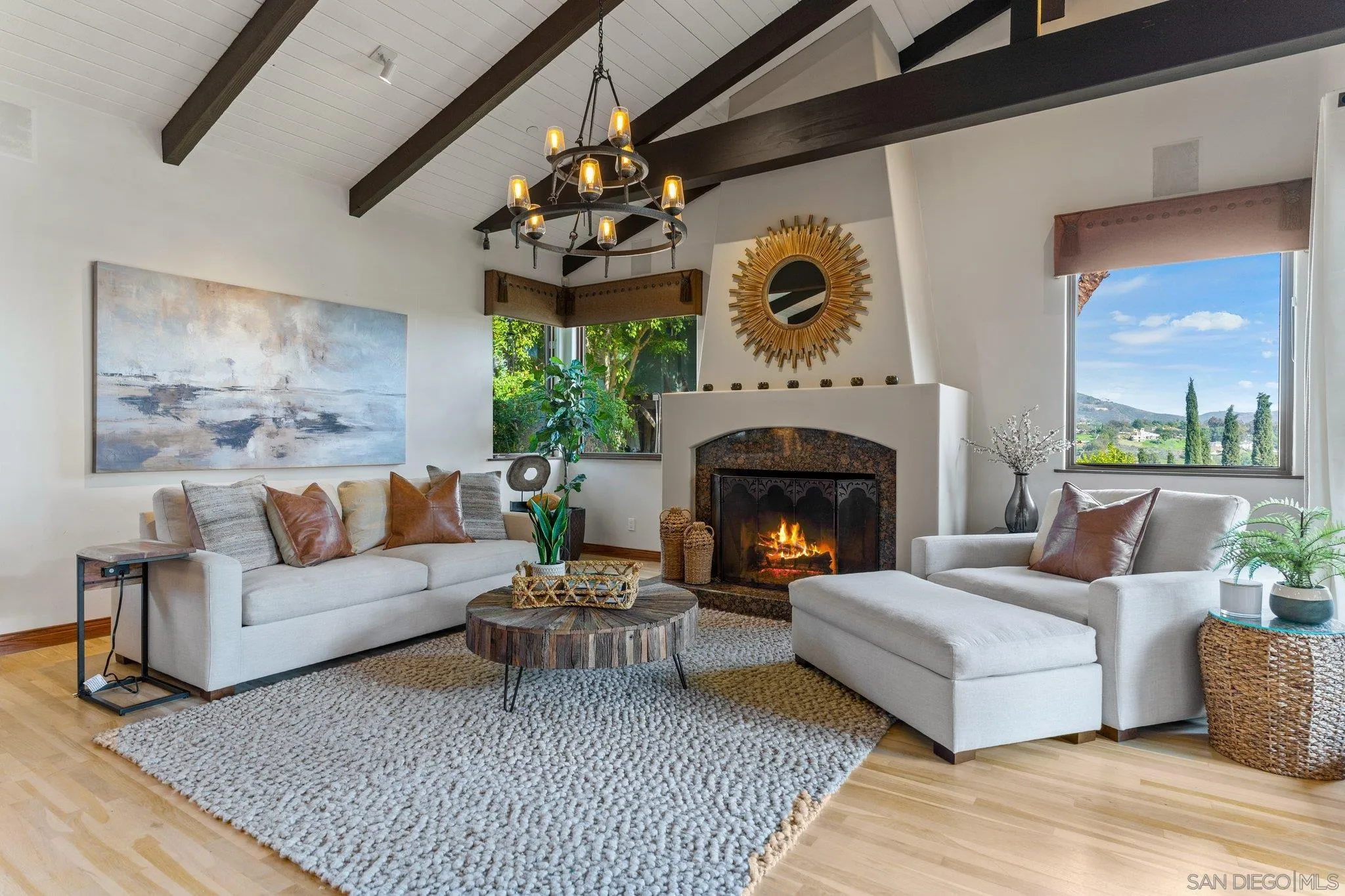3381 Calle Margarita Encinitas, CA 92024 - Photo 10 of 47 a living room with furniture and a fireplace