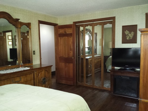 400 Walnut Plain Road Rochester, MA 02770 - Photo 12 of 24 a bedroom with a bed and a flat screen tv