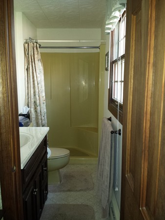 400 Walnut Plain Road Rochester, MA 02770 - Photo 13 of 24 a bathroom with a granite countertop shower a sink and a toilet