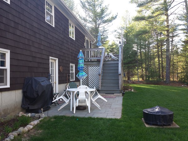 400 Walnut Plain Road Rochester, MA 02770 - Photo 24 of 24 a view of a chair and table in backyard of the house