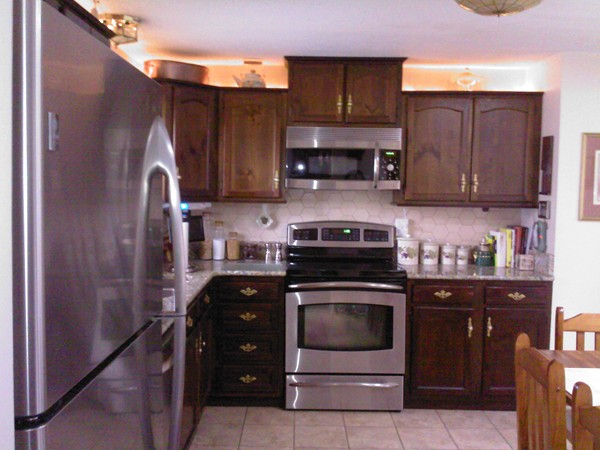 400 Walnut Plain Road Rochester, MA 02770 - Photo 7 of 24 a kitchen with stainless steel appliances granite countertop a stove a refrigerator and a cabinets