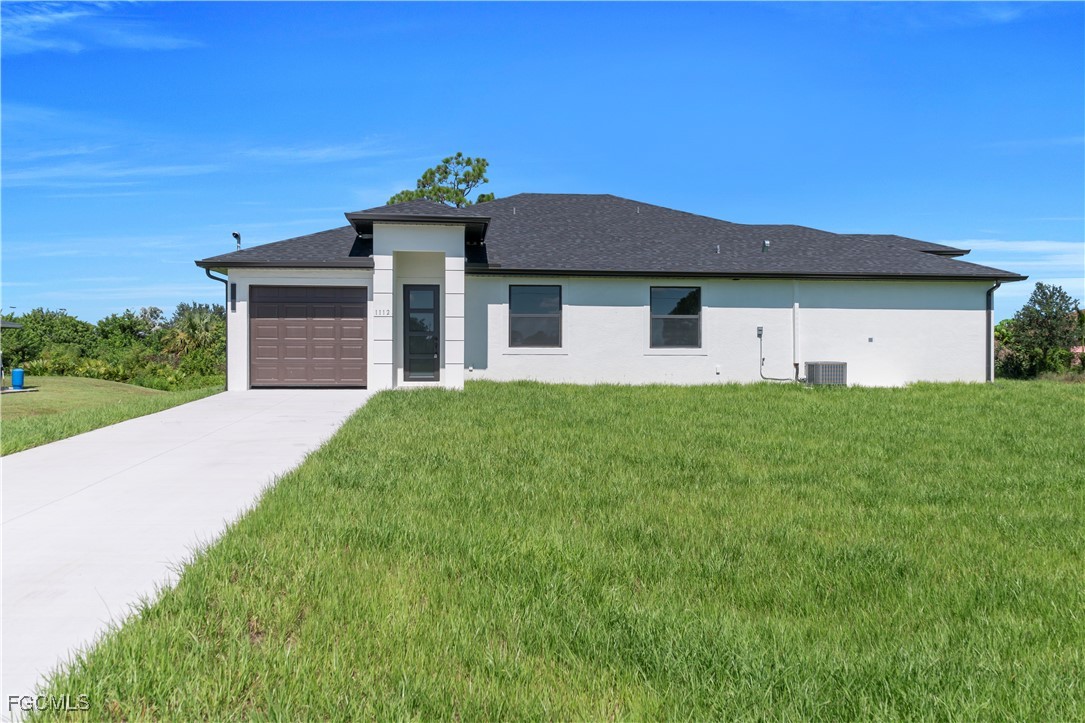 a front view of a house with a yard