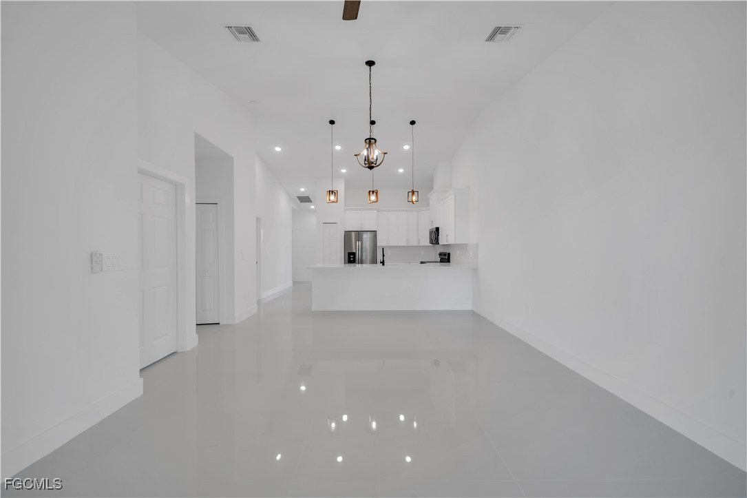 1110 Eisenhower Boulevard Lehigh Acres, FL 33974 - Photo 14 of 35 a bathroom with a sink mirror and a shower
