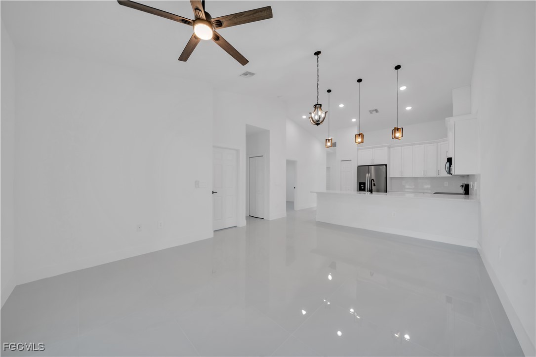 1110 Eisenhower Boulevard Lehigh Acres, FL 33974 - Photo 16 of 35 a view of a kitchen with a sink and a window