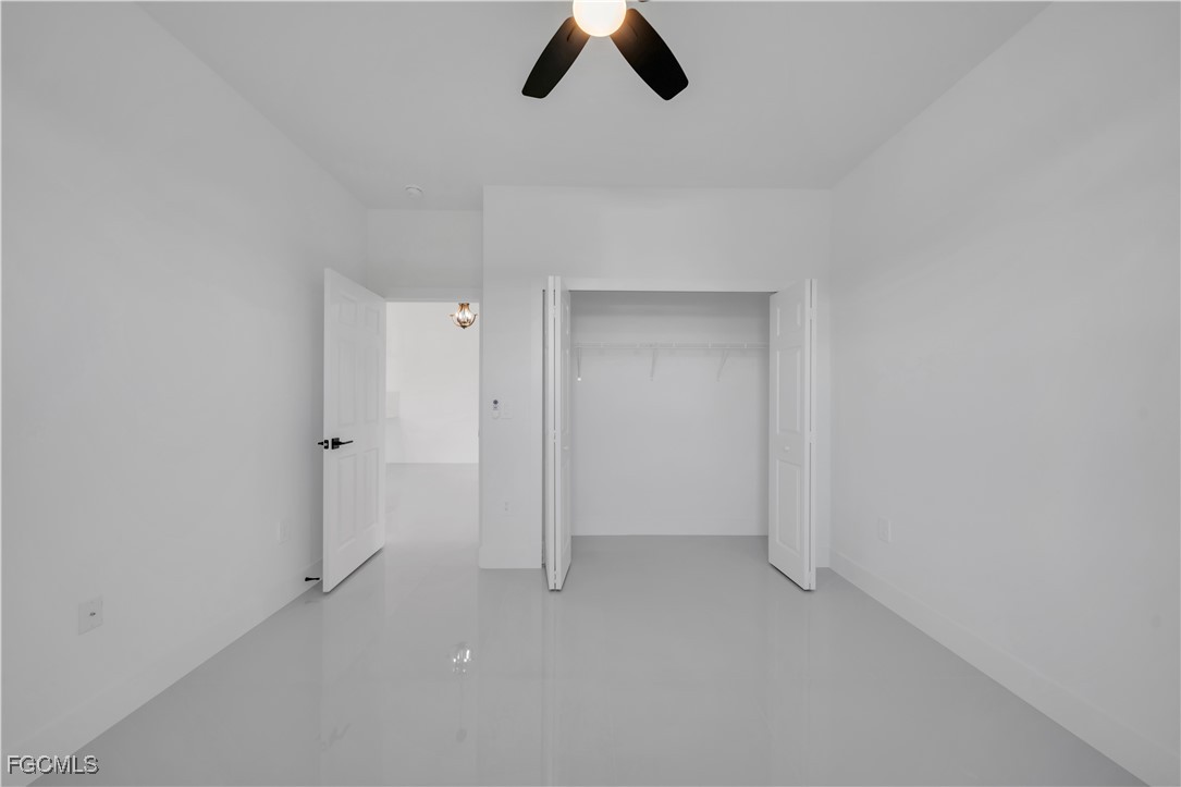 1110 Eisenhower Boulevard Lehigh Acres, FL 33974 - Photo 24 of 35 wooden floor in an empty room