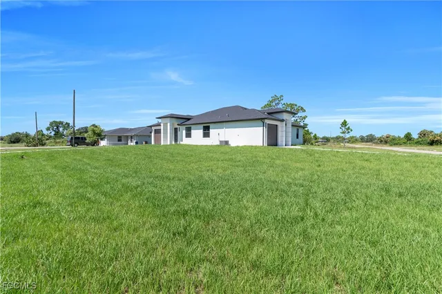 a view of a house with a big yard