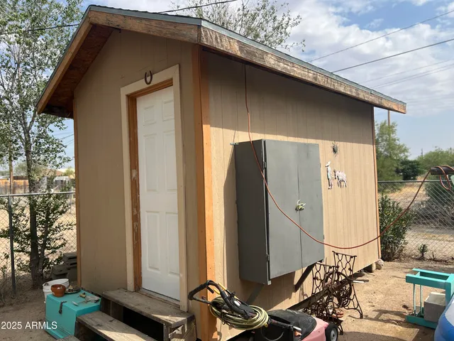 a couple of cars parked in front of a house