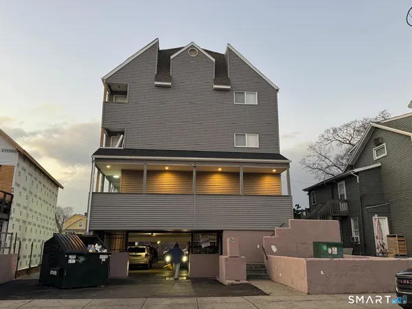 a front view of a house with parking space