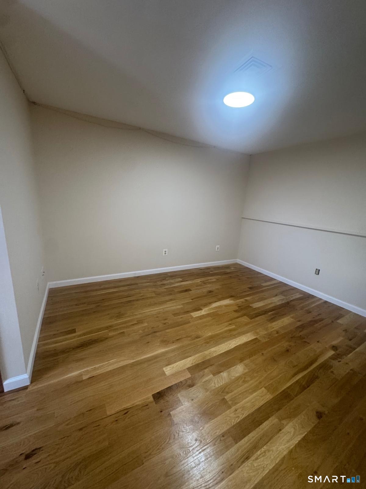 204 Wheeler Avenue, Unit 9 Bridgeport, CT 06606 - Photo 5 of 11 a view of a room with an empty space