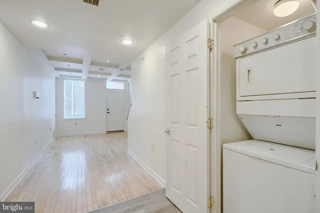a view of storage and utility room with washer and dryer