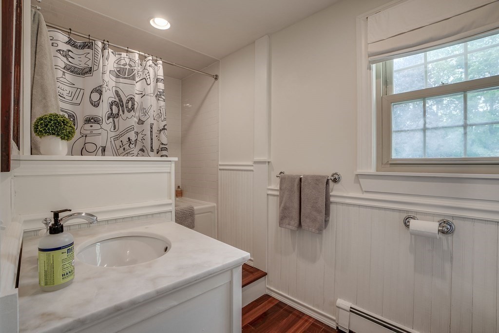 290 Concord Road Bedford, MA 01730 - Photo 16 of 41 a bathroom with a sink and a mirror