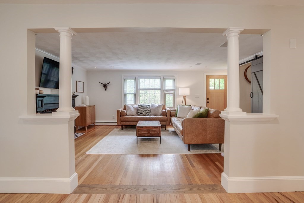 290 Concord Road Bedford, MA 01730 - Photo 8 of 41 a living room with furniture and a large window