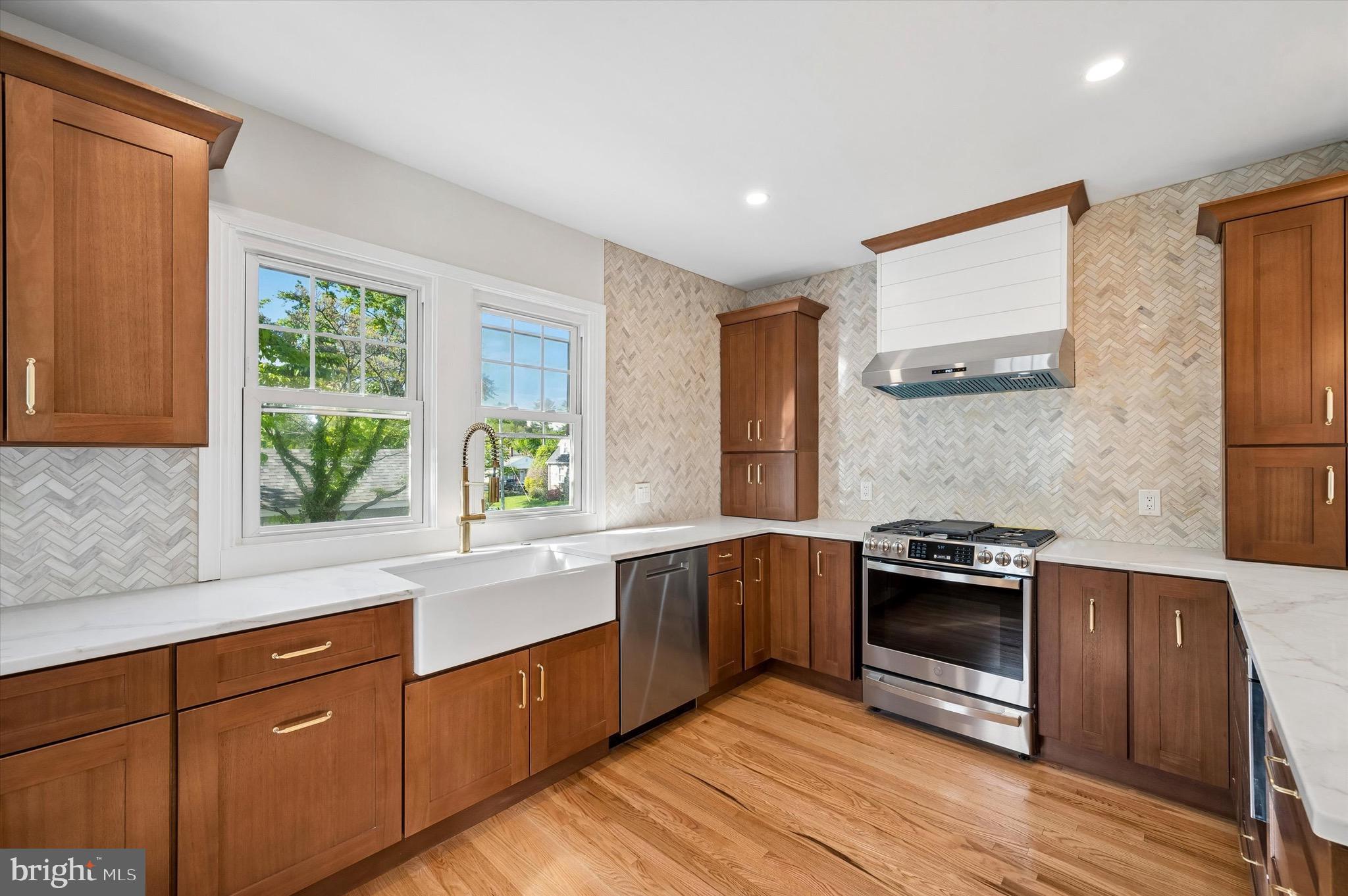 100 Yale Road Havertown, PA 19083 - Photo 13 of 35 a kitchen with stainless steel appliances granite countertop a stove a sink and a refrigerator