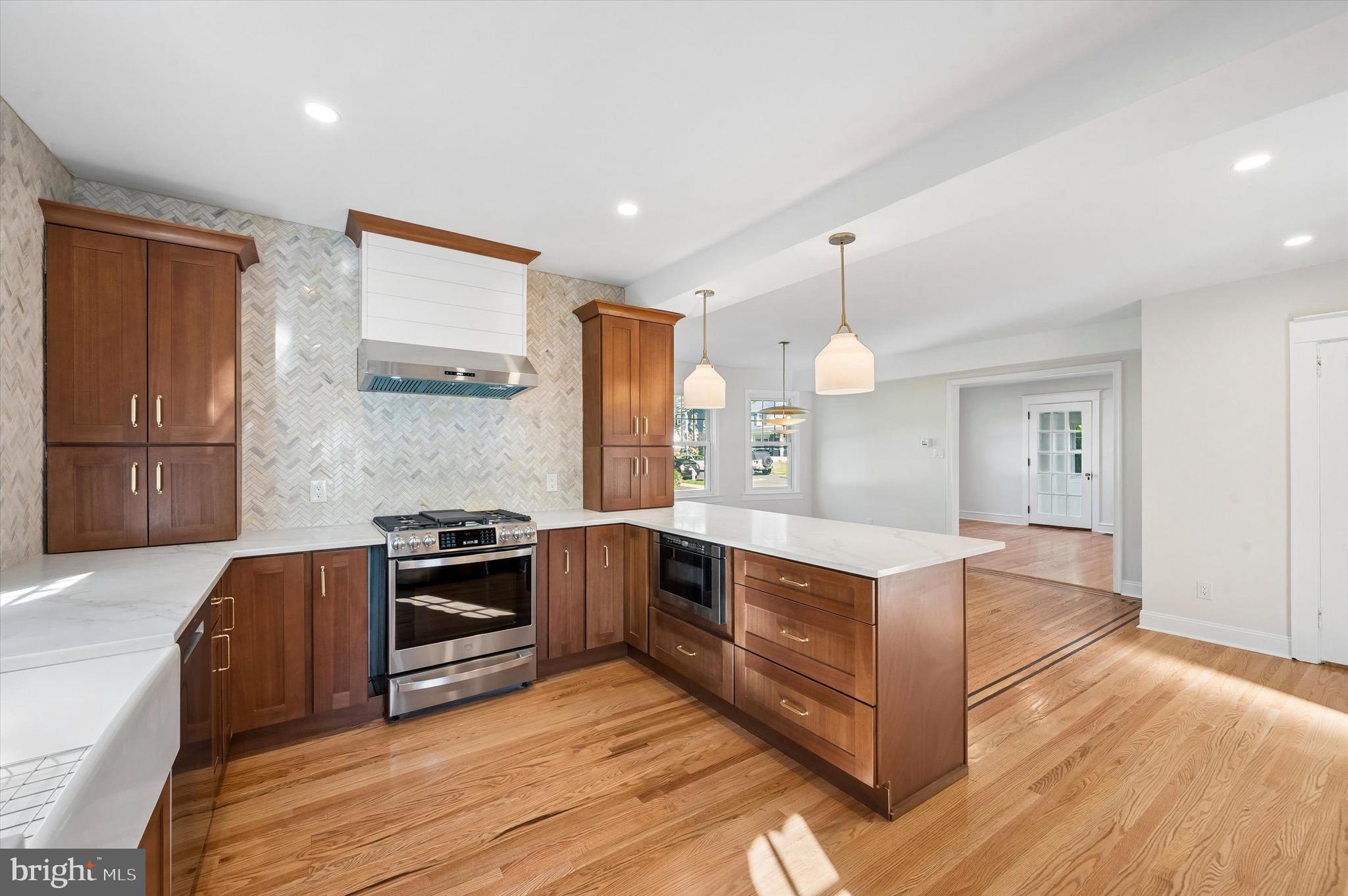 100 Yale Road Havertown, PA 19083 - Photo 14 of 35 a kitchen with stainless steel appliances granite countertop a sink and a stove top oven