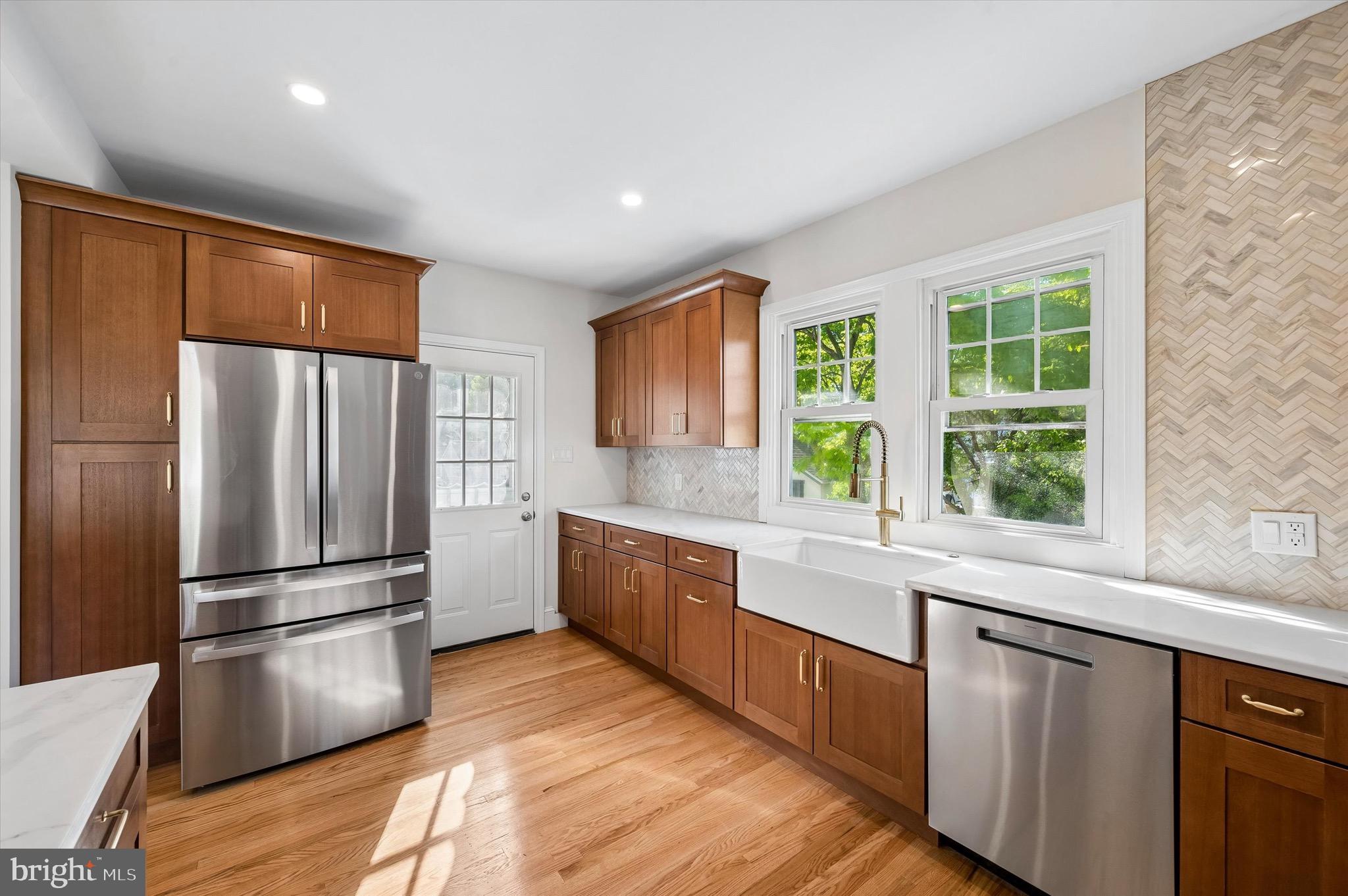 100 Yale Road Havertown, PA 19083 - Photo 16 of 35 a kitchen with stainless steel appliances granite countertop a refrigerator and a sink