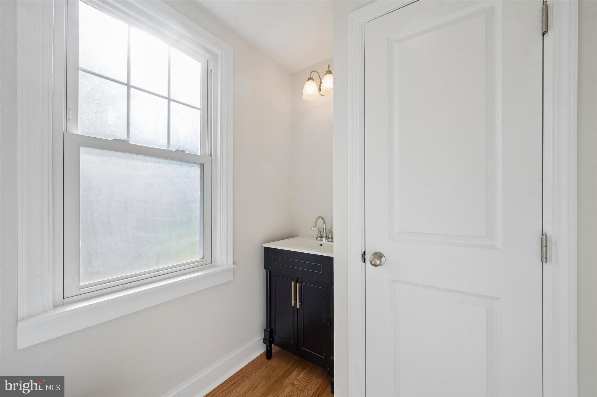 100 Yale Road Havertown, PA 19083 - Photo 17 of 35 an empty room with window and wooden door