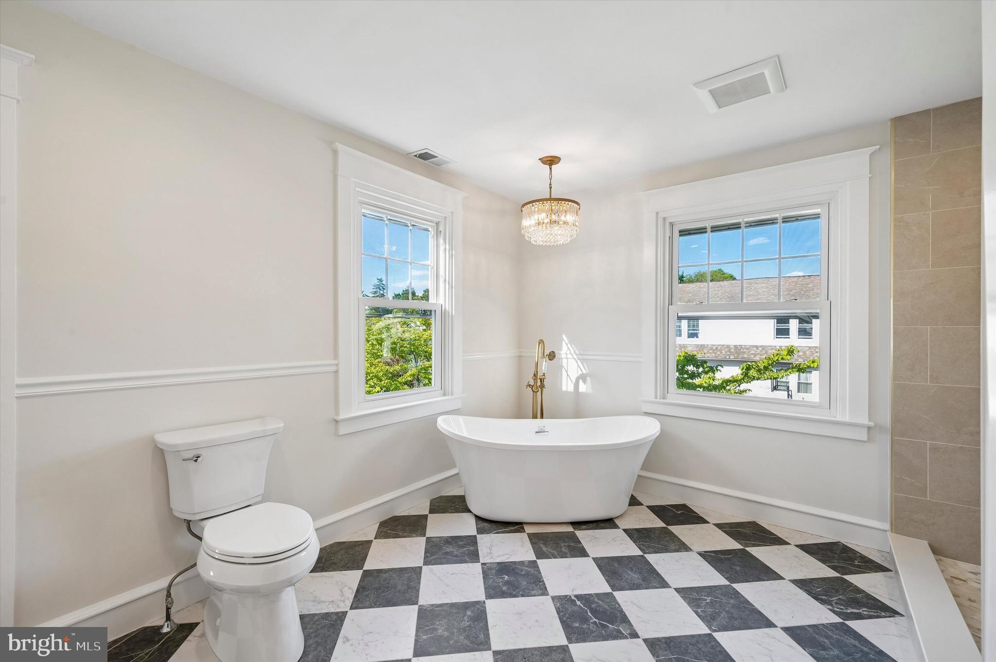 100 Yale Road Havertown, PA 19083 - Photo 21 of 35 a bathroom with a sink a toilet a window and mirror