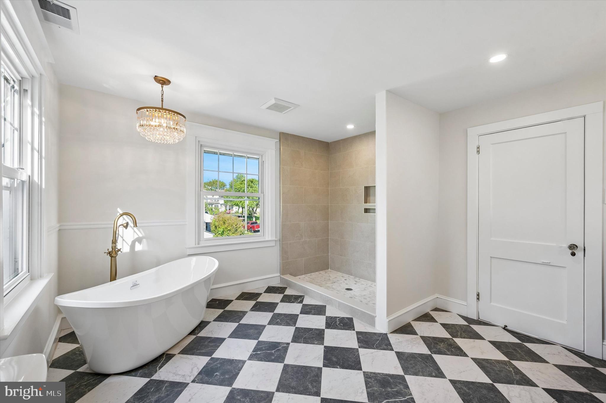 100 Yale Road Havertown, PA 19083 - Photo 22 of 35 a bathroom with a black and white checkered floor