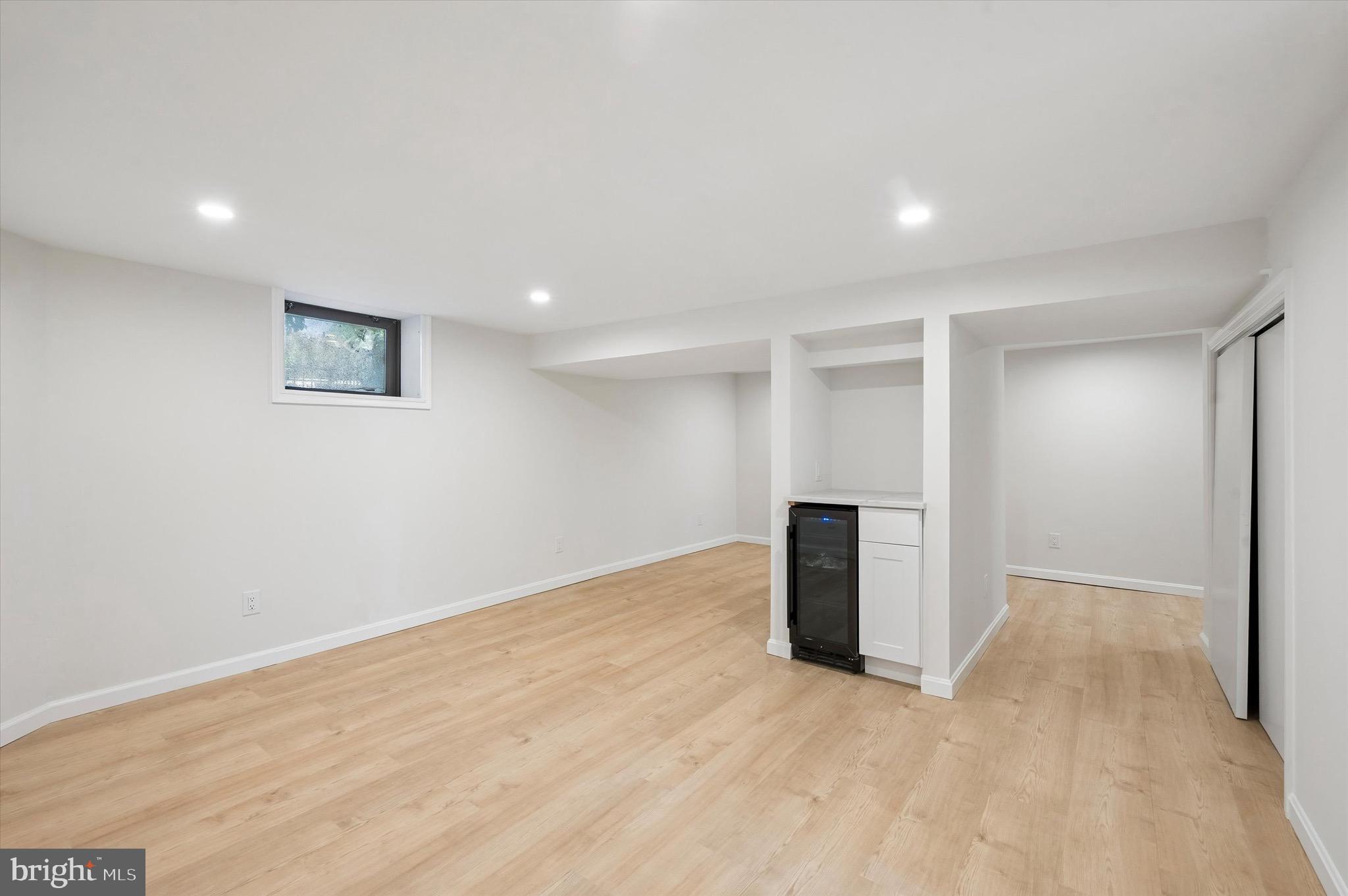 100 Yale Road Havertown, PA 19083 - Photo 30 of 35 an empty room with wooden floor and windows
