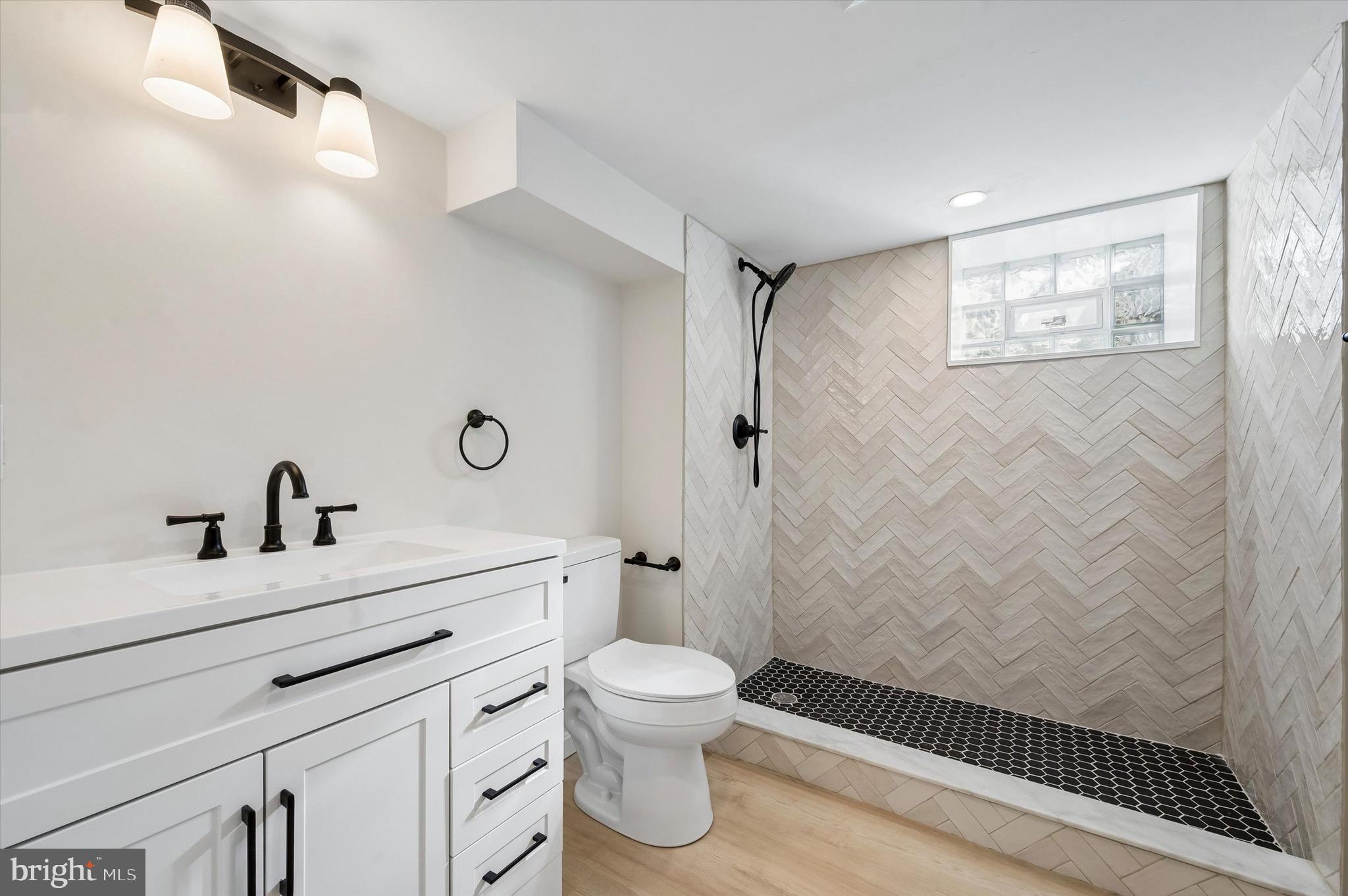100 Yale Road Havertown, PA 19083 - Photo 32 of 35 a bathroom with a sink a toilet and a mirror
