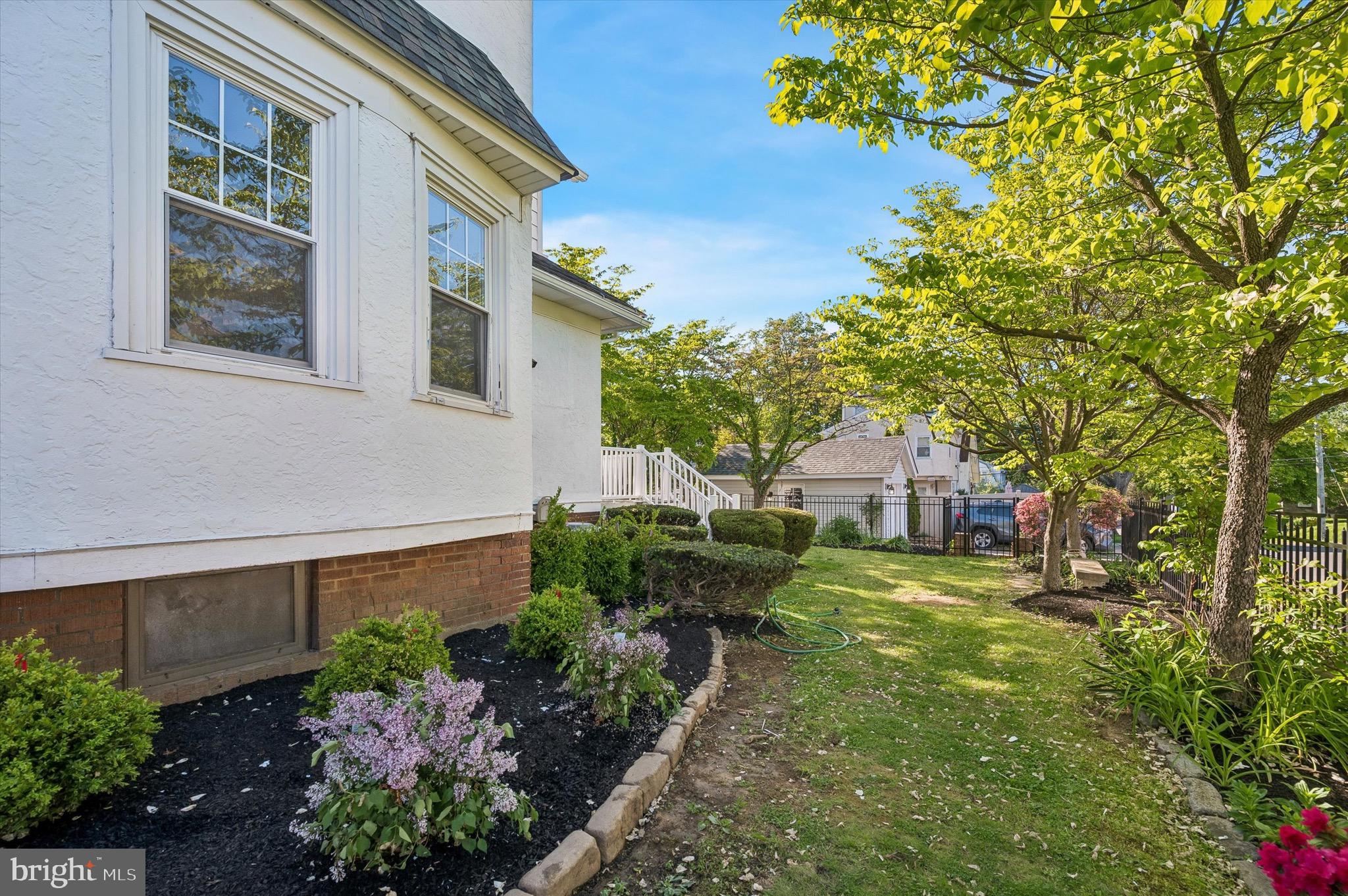 100 Yale Road Havertown, PA 19083 - Photo 33 of 35 a view of a house with a yard and potted plants